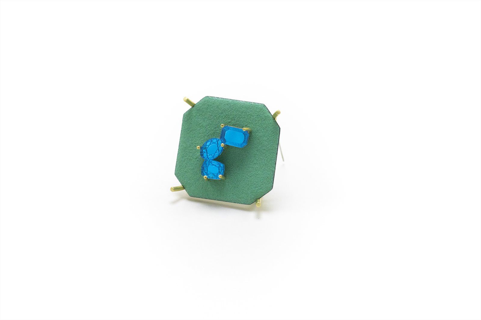 Octagonal green brooch set with two blue stones