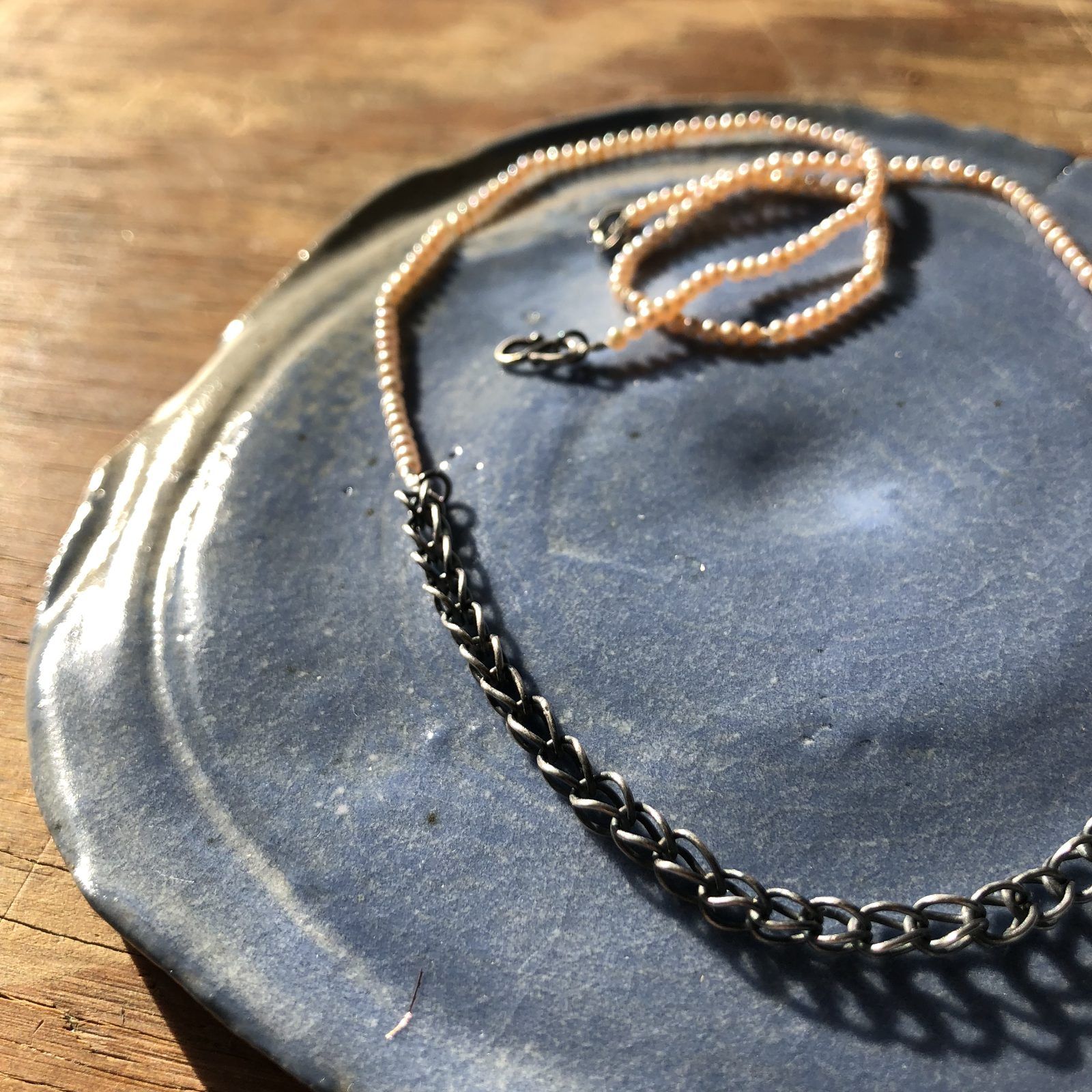 Necklace of tiny pearls joined to an oxidized silver chain