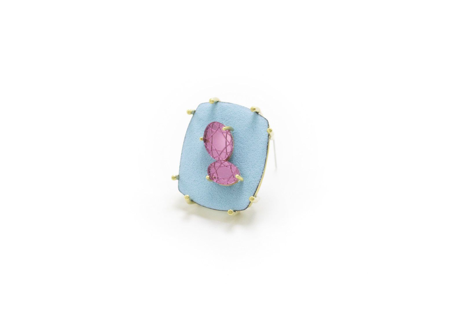 Pale blue brooch set with two pink faceted stones
