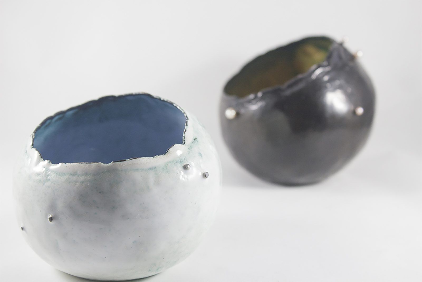Two enameled vessels with blue interiors